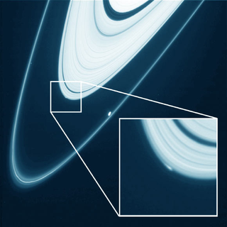 Illustration for article titled La NASA capta por 1ª vez una posible luna en formación en Saturno